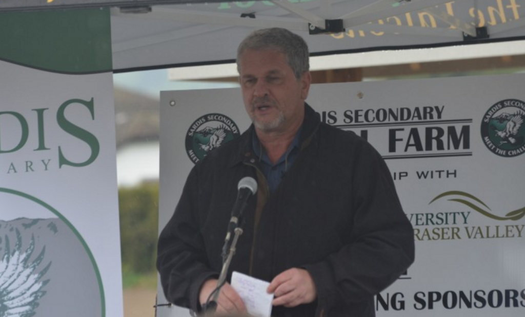 Tom Baumann speaks at the breaking ground ceremony of Sardis Secondary's Farm Program